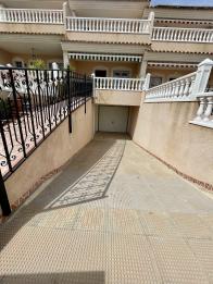 Immaculate large South facing 3 bed 2 bath townhouse with sea views and private garage for 3 cars in Orihuela costa.