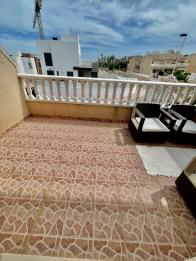 Immaculate large South facing 3 bed 2 bath townhouse with sea views and private garage for 3 cars in Orihuela costa.